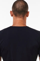 Upper back view of Men's Edge Performance Tee. Workout tee with holes for ventilation.