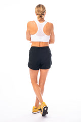 Back view of Swish Shorts. Women's loose black running shorts.
