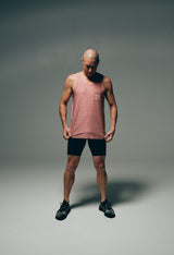 Men's Sprinter shorts with red tank top. Model wearing black running shorts with red singlet.