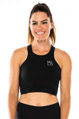 Black Core Crop. Women's black form-fitting tank top for workout or casual wear.