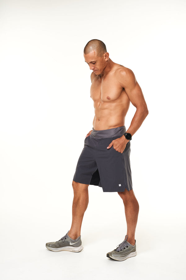 Left view of charcoal Arvo shorts. Men's gym shorts with comfortable 4-way stretch waistband.