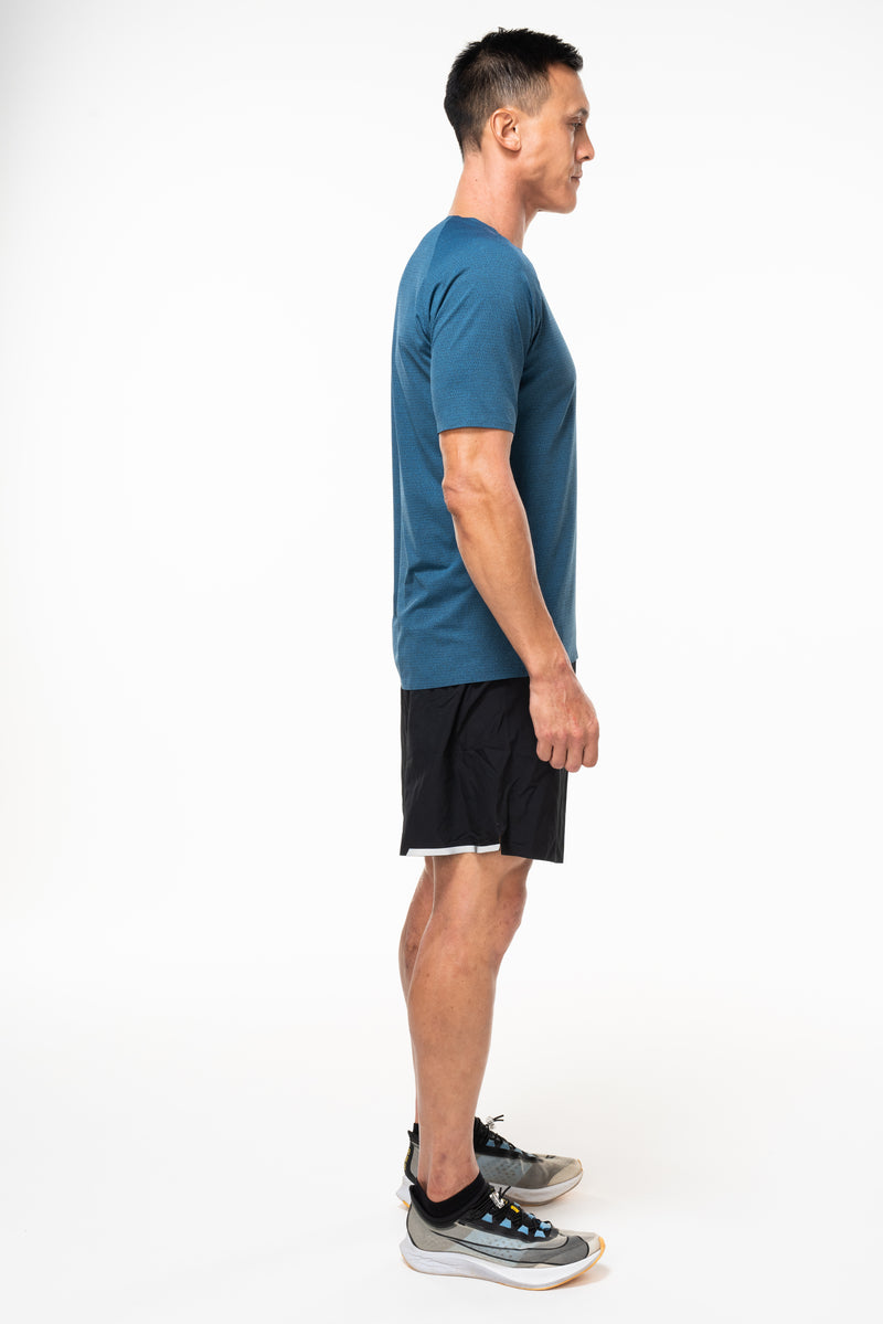 Right view of men's Spectrum Tee - Cobalt. Breathable blue workout shirt. Sweat-wicking short sleeve shirt.
