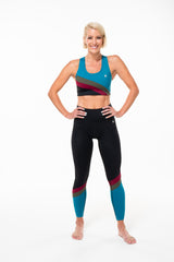 Model wearing Pulse Hi Rise Luxe Leggings with matching sports bra. Multicolor sports bra and leggings pair.