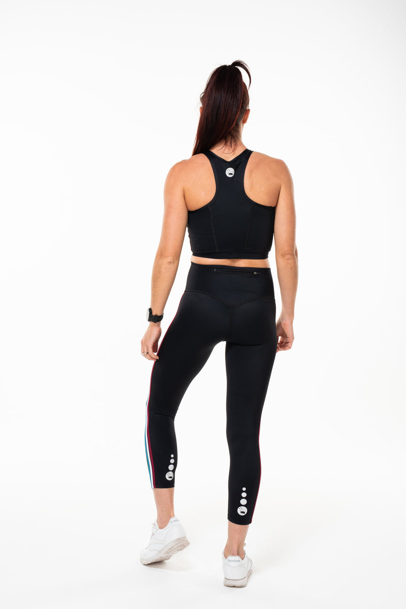 Back view Strata 7/8 Leggings. Black leggings with reflective logo. Long length yoga pants.