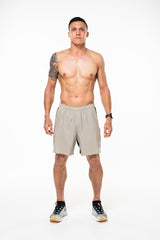 Men's Sand/Black Noosa Run Short. Tan run shorts with mesh liner. Running shorts with 7" inseam.