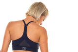 Back view Navy Sunshine Bra. Breathable sports bra with mesh panel.