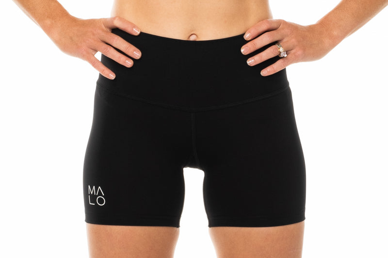 Black Little Bit Longer Shorts. Women's yoga shorts with light compression and high waist.