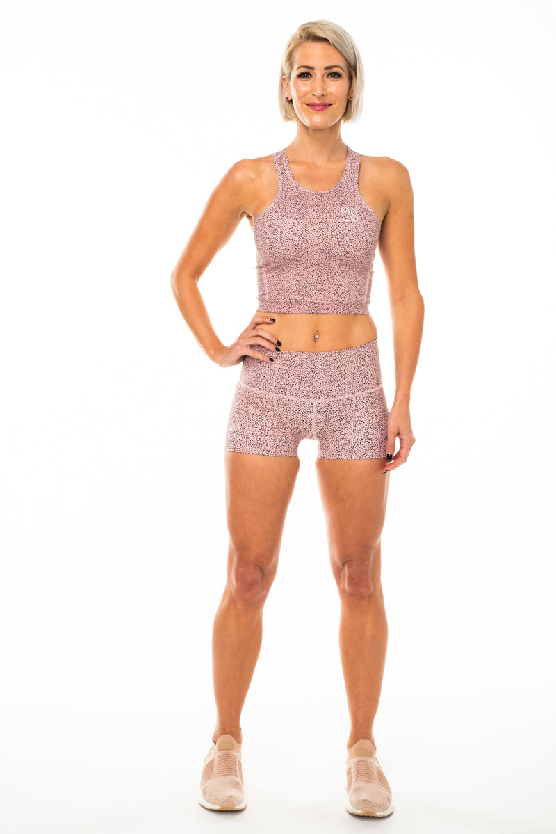 Model wearing Baby Cheetah PR Shorts. Women's cheetah print athleisure shorts.