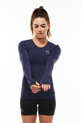 Women's long sleeve running shirt. Performance tee with thumbholes to keep in warmth.