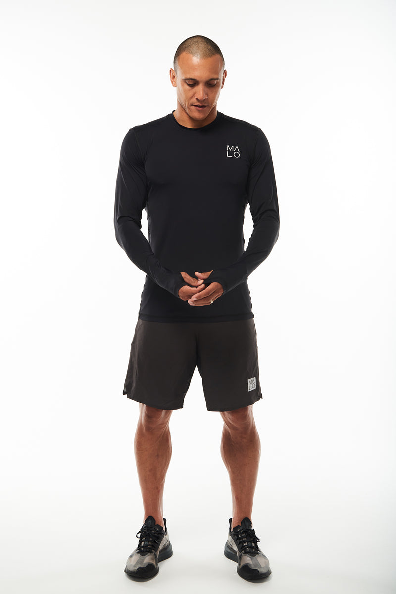 Men's long sleeve running shirt. Performance tee with thumbholes to keep in warmth.