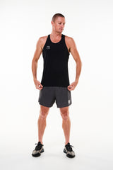 Model wearing men's Noosa Run Short with black singlet. Mid-thigh black run shorts with mesh liner.