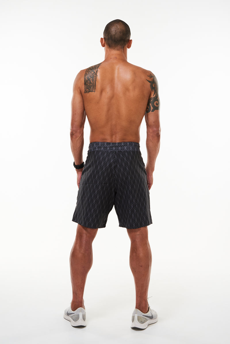 Back view of Arvo Shorts. Above the knee black workout shorts. Black athleisure shorts.