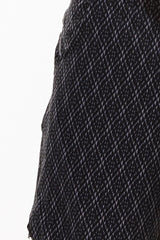 Close view of Black Motif Arvo Shorts fabric. Black and grey diamond print design. Workout shorts.