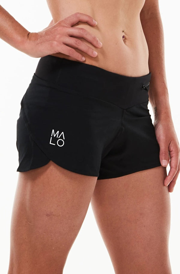Women's Run The World Shorts. Black relaxed fit running and workout shorts. White logo on right leg.