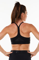 Back view Black Sunshine Bra. Environmentally friendly sports bra with mesh panels.