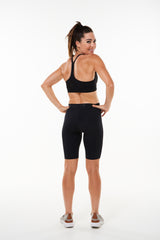 Back view of Pedal Pumpers. Black Long running shorts with light compression.