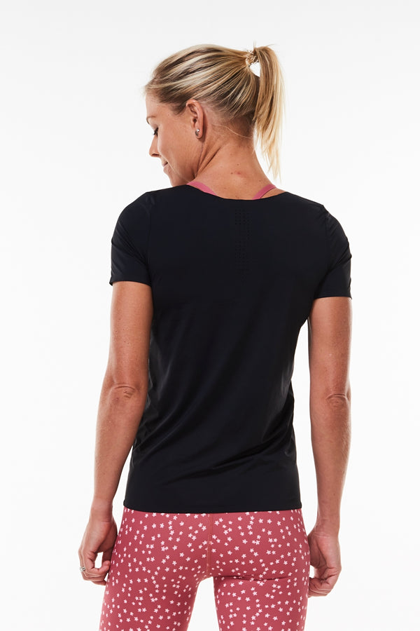 Back view Women's Edge Performance Tee. Black sweat-wicking T-shirt with mid-hip hemline.