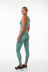 Back view Hi Rise Luxe Leggings. Green leggings with reflective logo. Long length yoga pants.